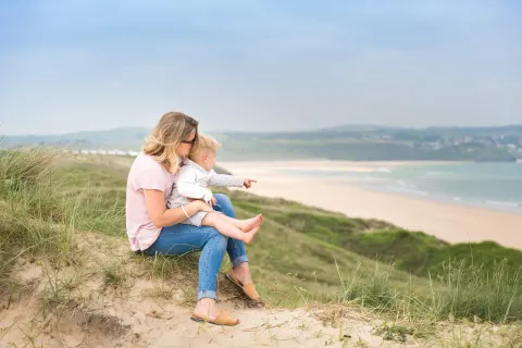Image june-holidays-cornwall-1788520814 for Mother and child on the coast path