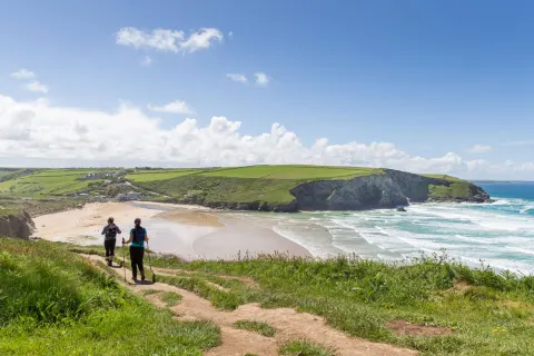 Image locations-north-cornwall-porth-mawgan-porth-1778158180 for Couple walking on the coast path
