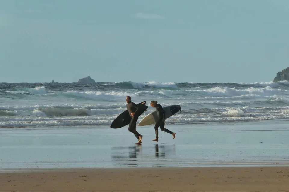 Image november-holidays-cornwall-1788270032 for Couple surfing on the north coast