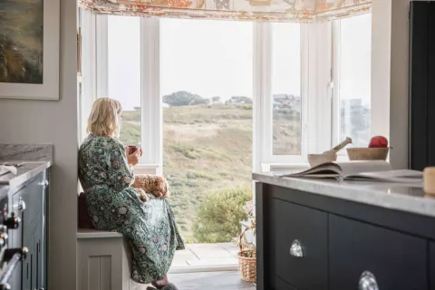 Image september-holidays-cornwall-1783512118 for Lady looking towards the sea at Col Ros