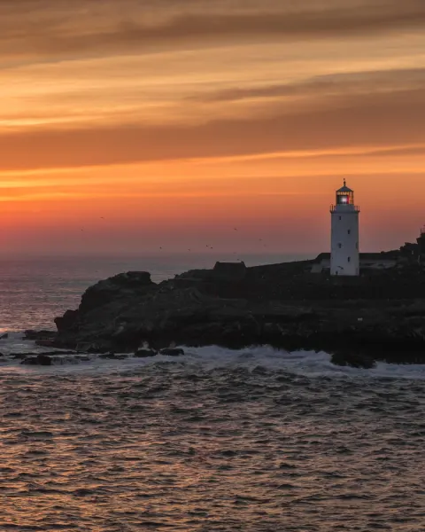 Image cornwalls-most-instagrammable-spots-1781176923 for An image of sunset at Godrevy Lighthouse, Cornwall